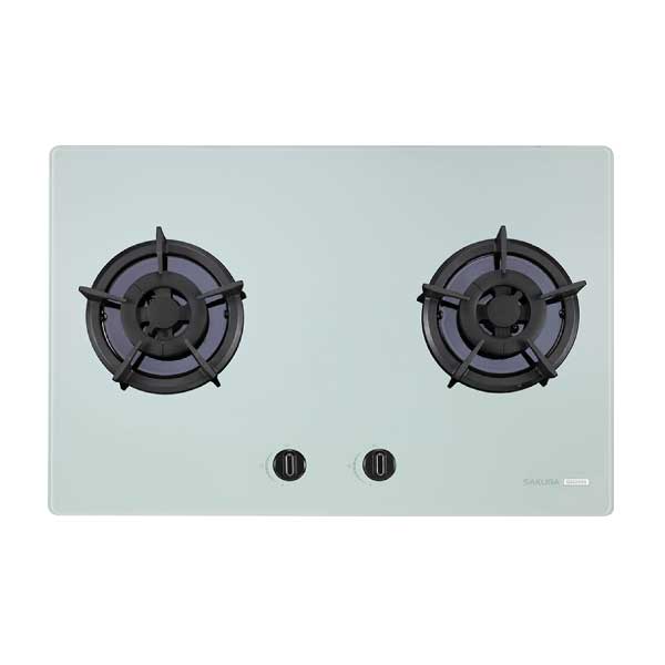 Two-burner gas cooktop with black grates and central control knobs on a light gray surface