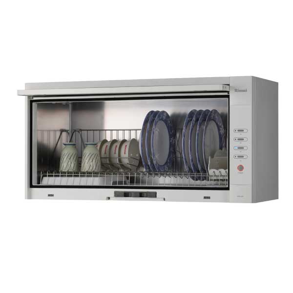 Compact dishwasher with plates, cups, and mugs loaded on the racks for cleaning.